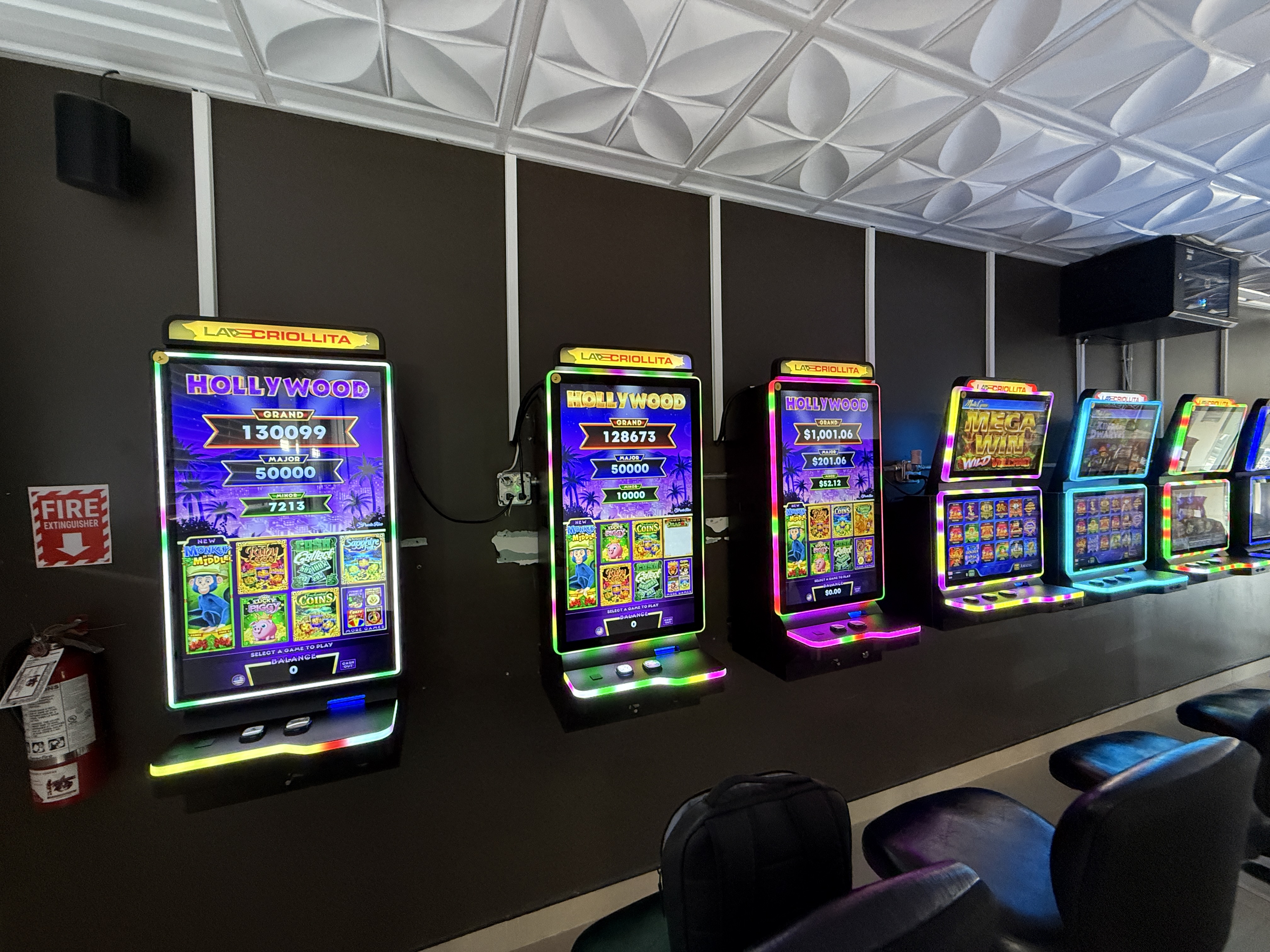 Row of working La Criollita machines in a venue